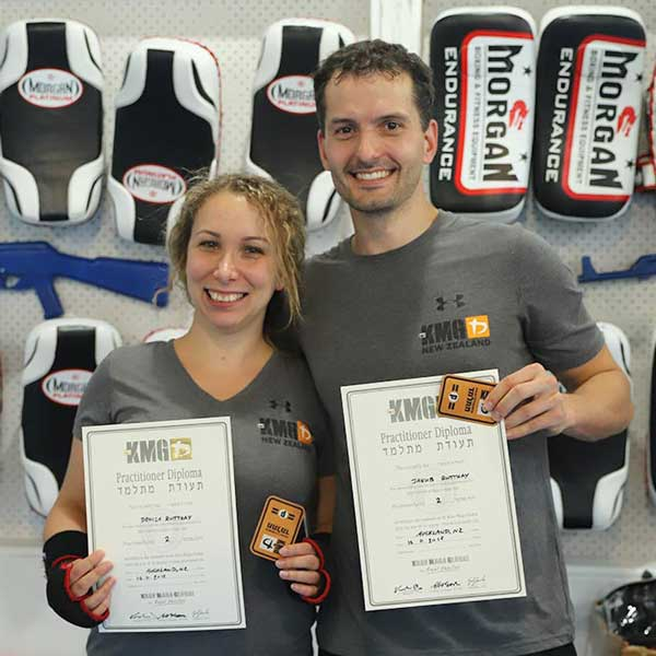 Denise and Jacob with their diplomas after passing a KMG grading in New Zealand