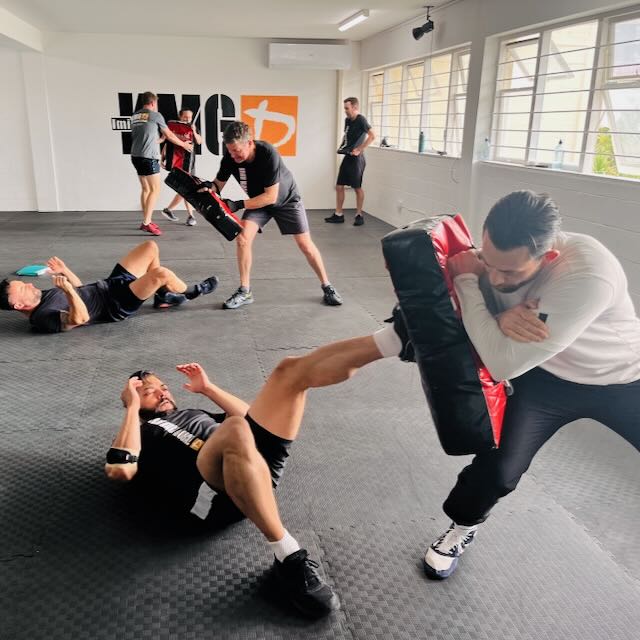 KMG New Zealand students training ground defence techniques