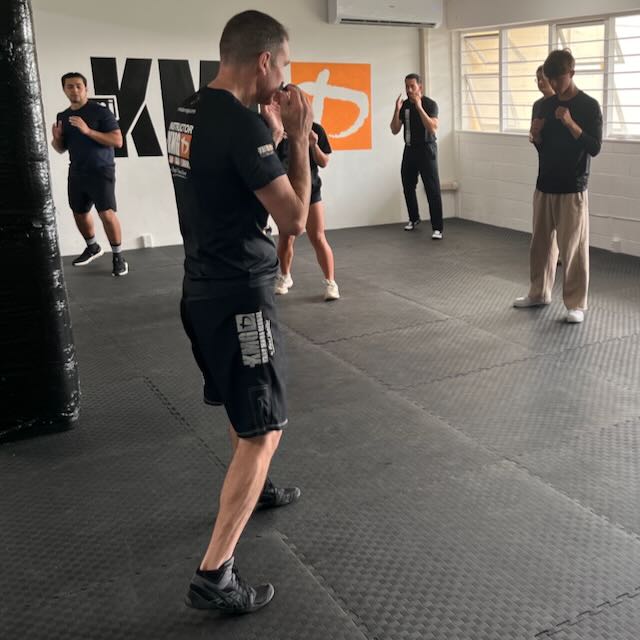 KMG New Zealand instructor teaching beginners stances in class