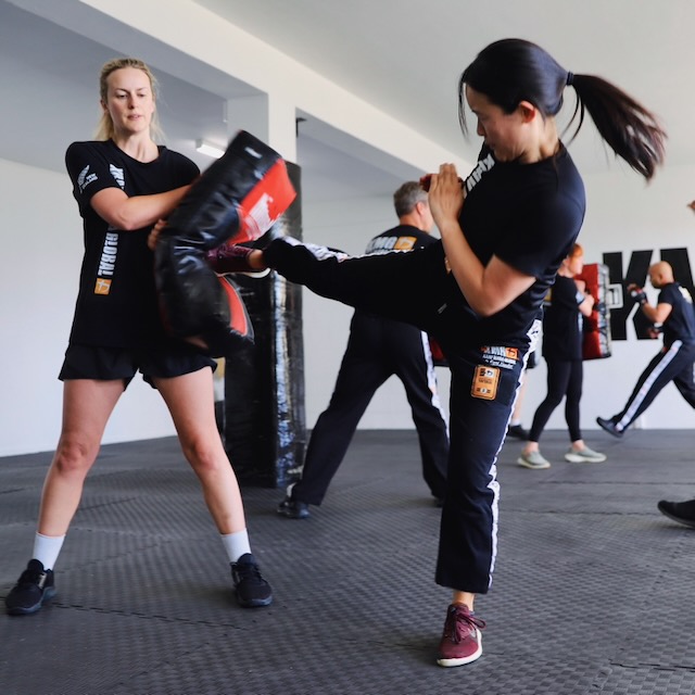 Krav Maga Auckland student executing a roundhouse kick during training at Birkenhead, North Shore