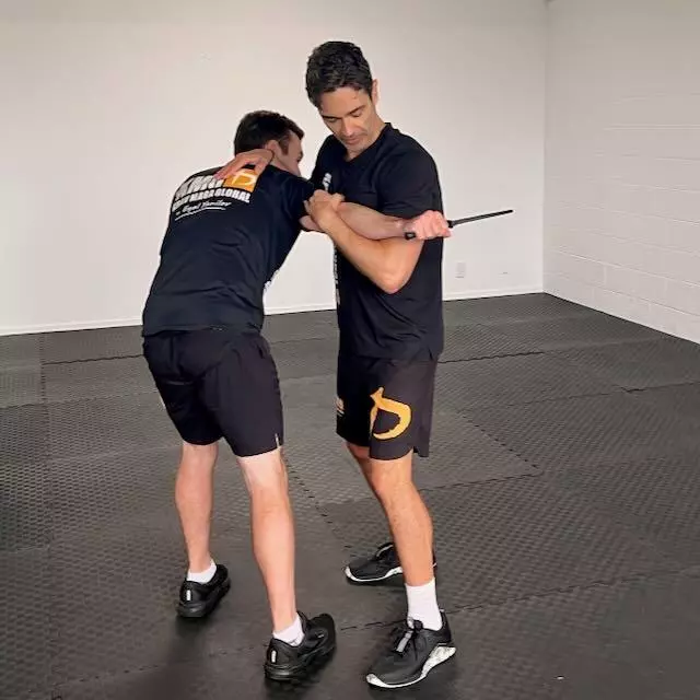 Krav Maga Auckland student practising knife defence at Birkenhead, North Shore