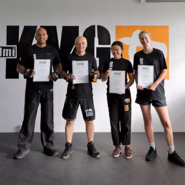 Four members with their KMG diplomas on grading day at Krav Maga Auckland in Birkenhead