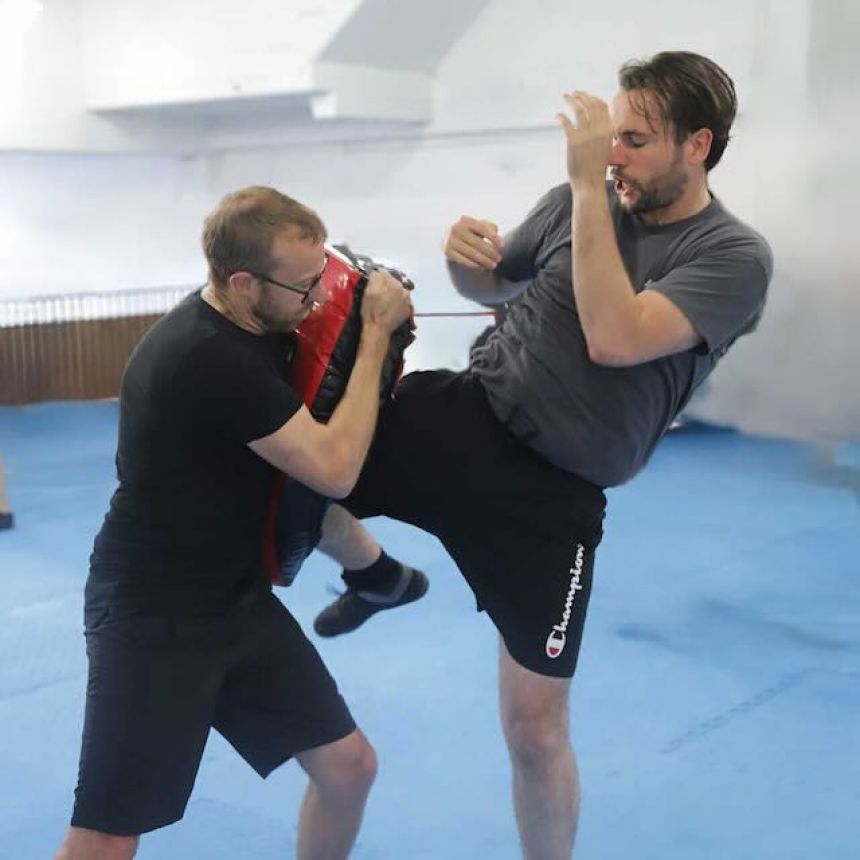 Student drilling a knee strike technique during Krav Maga training at North Shore Auckland