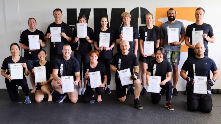 KMG course participants receiving certificates of completion